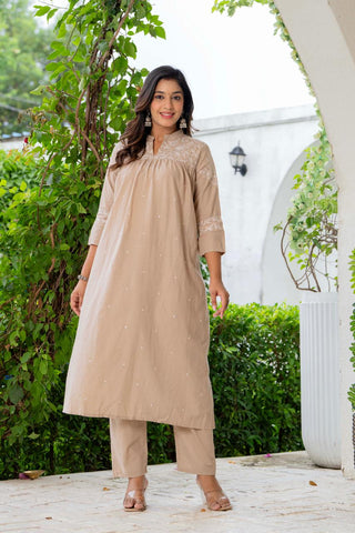 Kurta Nude Silk Blend Solid Embroidered Flared Suit Set