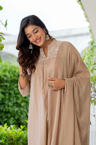 Kurta Nude Silk Blend Solid Embroidered Flared Suit Set