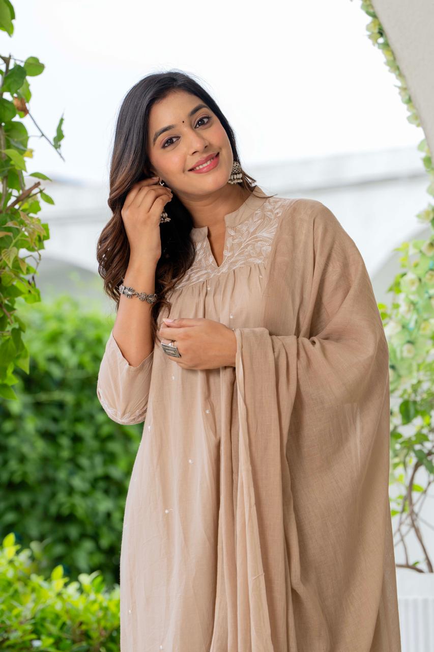 Kurta Nude Silk Blend Solid Embroidered Flared Suit Set